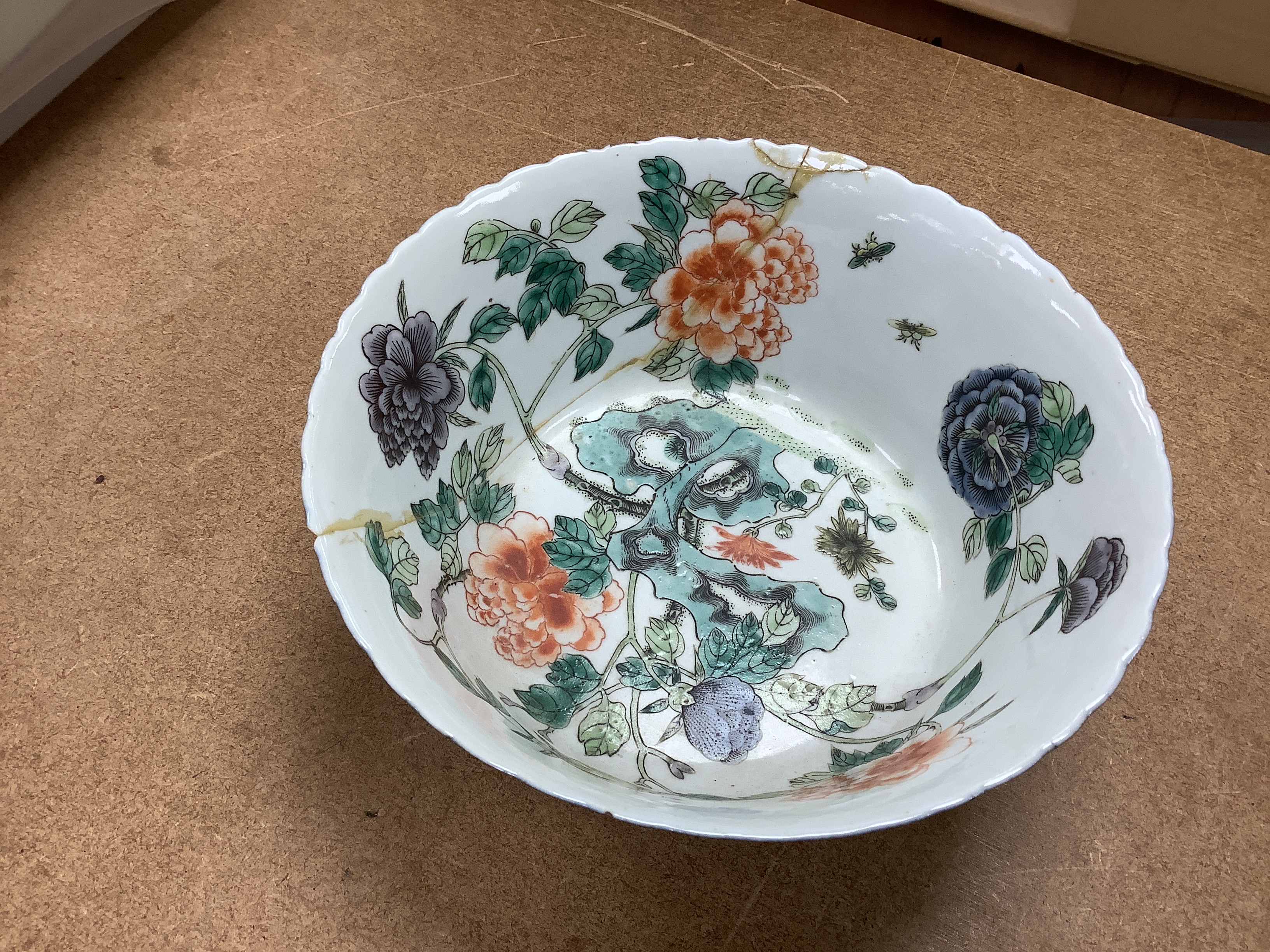 Two Chinese blue and white prunus jars, and a famille verte powder blue bowl, late 19th/early 20th century, tallest 17.5cm